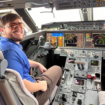 corporate pilot in the plane with glasses