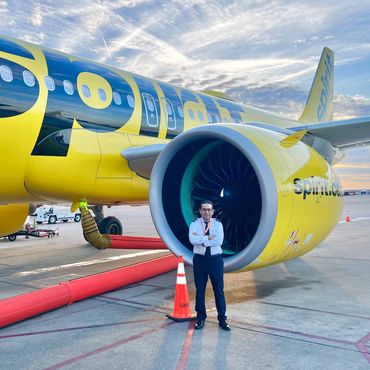 airline and corporate pilot standing near a plane