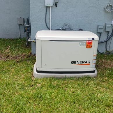 A Generac standby generator installed outside a house.