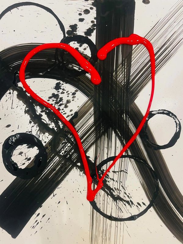 Abstract black brush strokes with a bold red heart outline on a white background.
