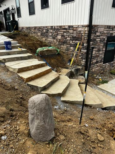 Our team at Northpoint Excavating recently completed a custom natural stone steps install.