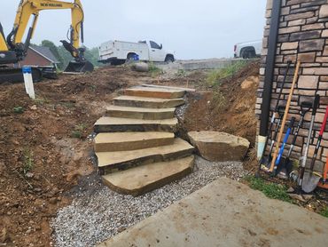Our team at Northpoint Excavating recently completed a custom natural stone steps install,