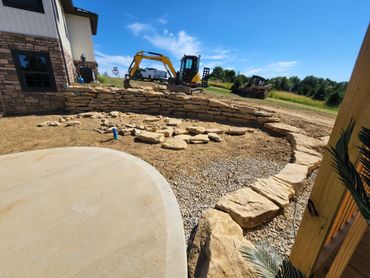 Northpoint Excavating recently completed a custom natural stone retaining wall install.