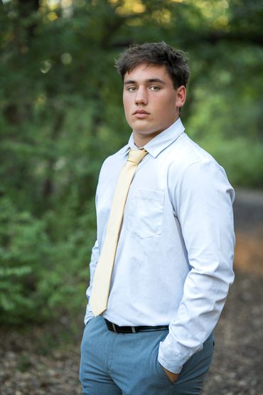 Guy in dress clothes and yellow tie
