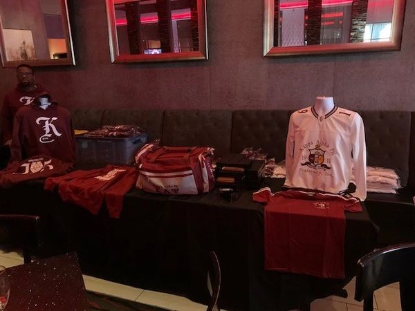 View of the jerseys and bags on the table