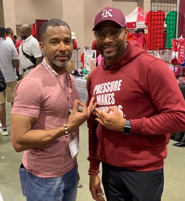 Two men posing for a picture