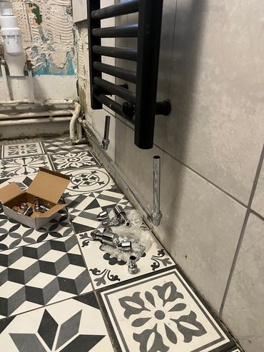 New piping and fitting radiator/toilet with sink basin fitting.