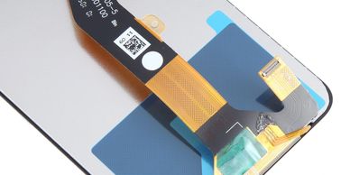 Close-up of a smartphone LCD screen replacement with flex cable.