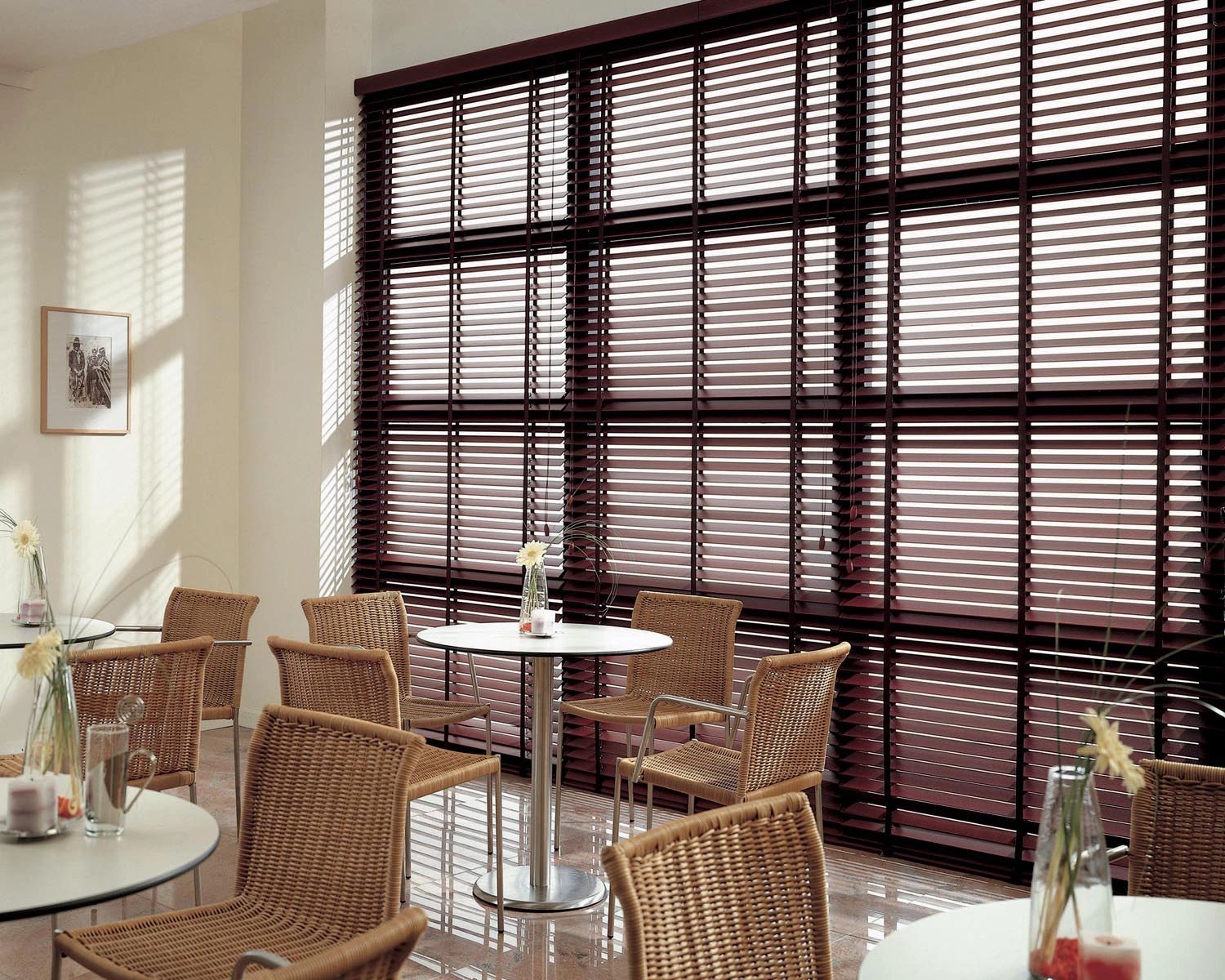 Wood blinds on big, tall window for small business. Venetian blinds at restaurant. Anytime Blinds NC