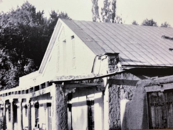 A black and white picture of an historical building