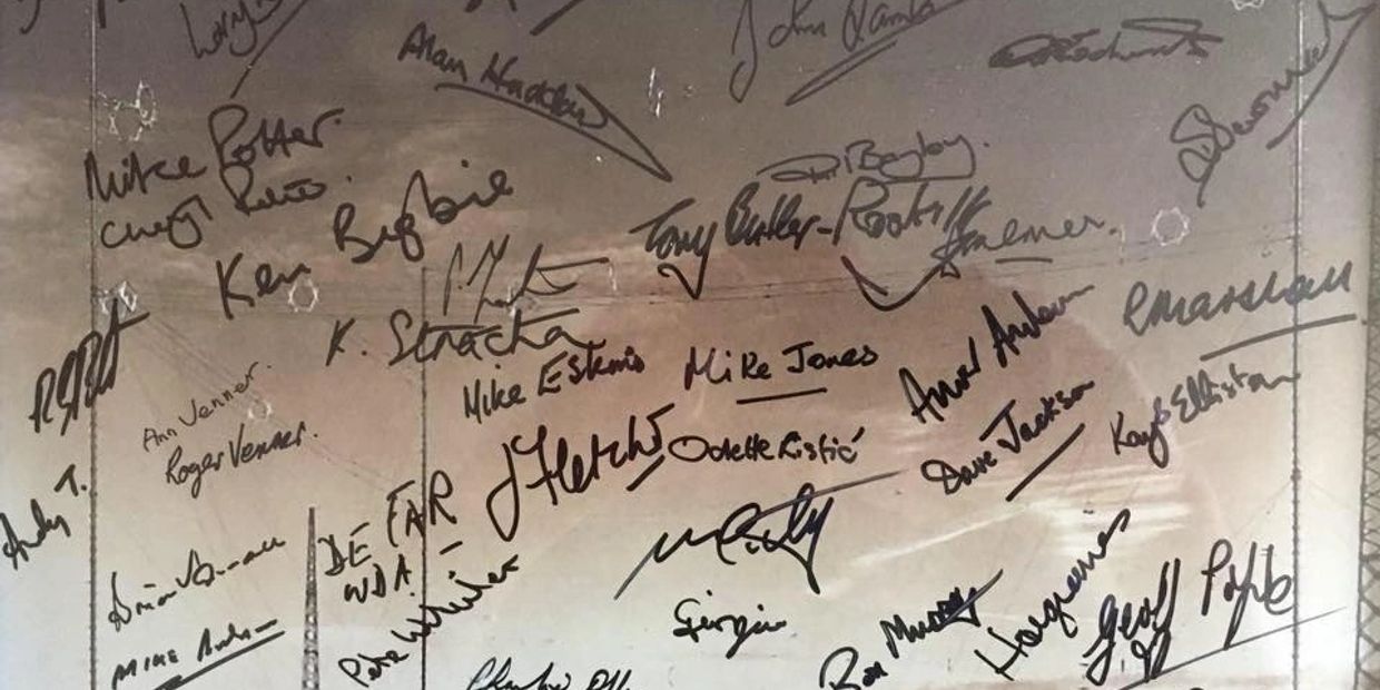 Commemorative photograph signed by all attendees at the 90th Anniversary reunion.