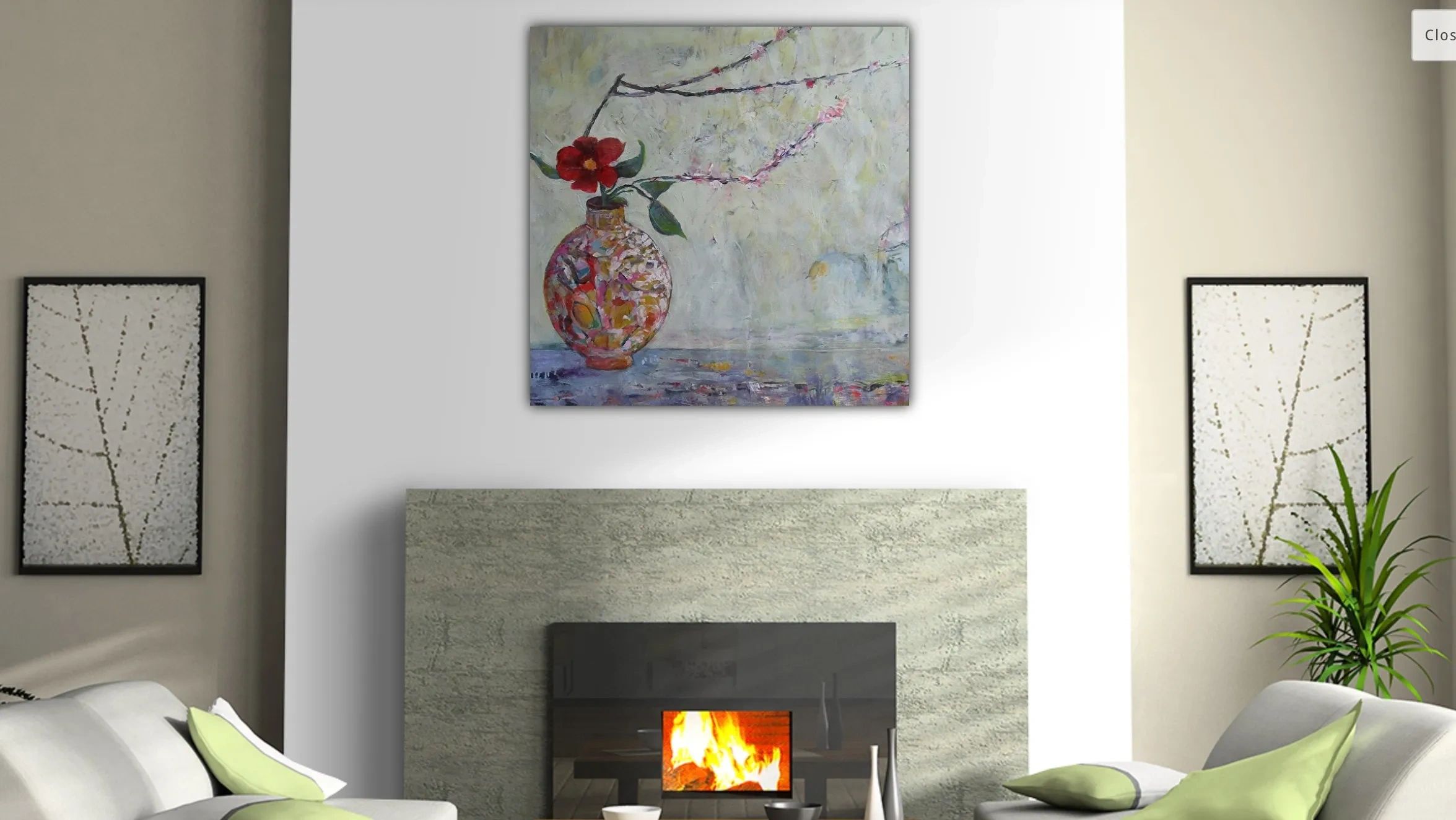 Modern living room with a cozy fireplace and floral artwork.