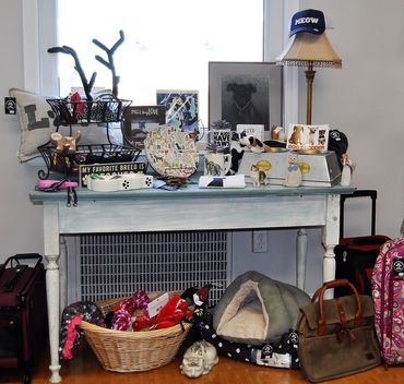 pet goods, including beds, toys, decor, leashes, crates and carriers, and decor