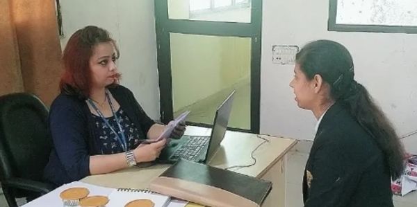 Two women having a discussion in an office.