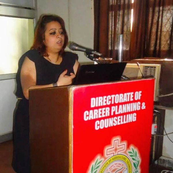 Woman speaking at a Directorate of Career Planning and Counselling podium.