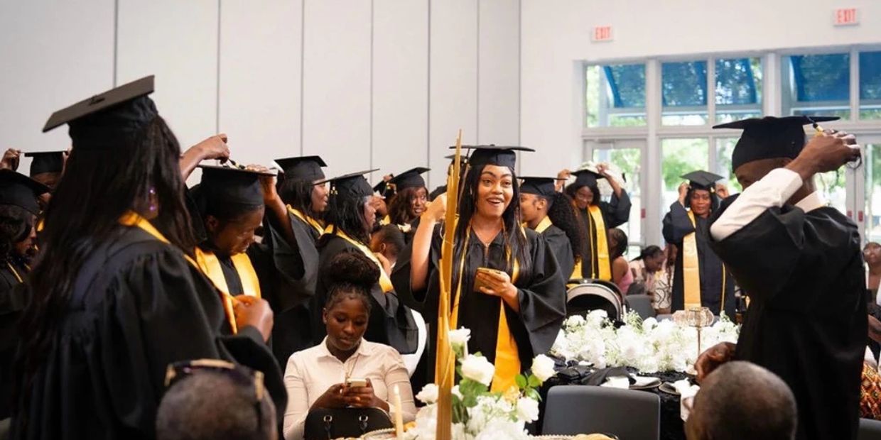 A lively graduation ceremony with graduates in caps and gowns celebrating.