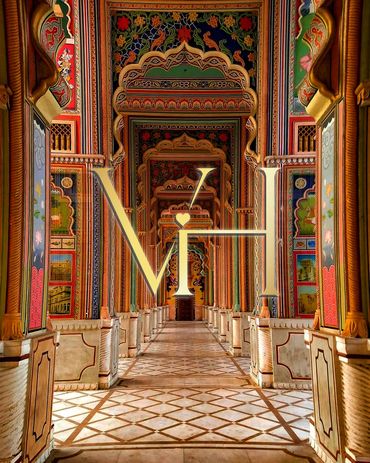 Intricately decorated corridor with vibrant arches and detailed artwork.