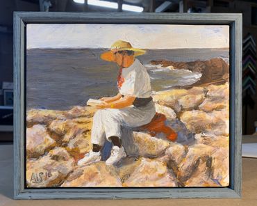 Painting of a woman at a beach on stretched canvas with distressed blue floater frame 