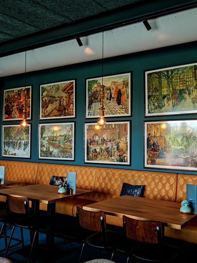 Ten framed art prints in business at restaurant