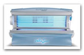 An open UV tanning bed with blue lights glowing.