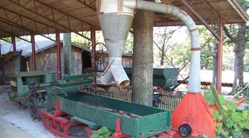 Grain wagon and separator on display at Har-Ber Village.