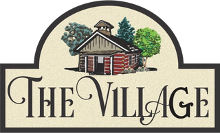 "The Village" sign with Har-Ber Village logo.