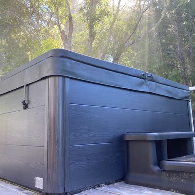 Brand new hot tub in the forest at the Vacation Rental near Jordan River called the Surf Chalet.