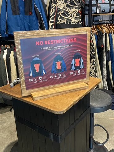 Upcycled graphic display for O'Neill's snow collection positioned on a repurposed wooden plinth.