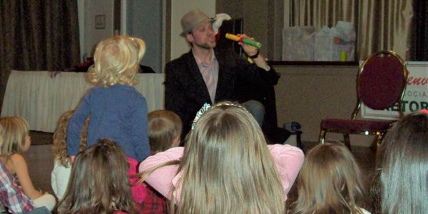Scott performing for a large group of children at a Community Centre!