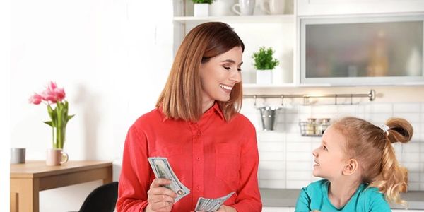Image of parent and child in kitchen.