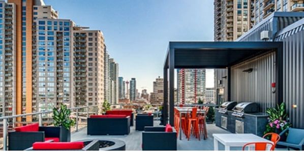 Image of an outdoor patio surrounded by office buildings.