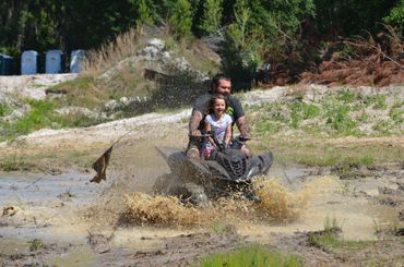 dad and daughter on atv