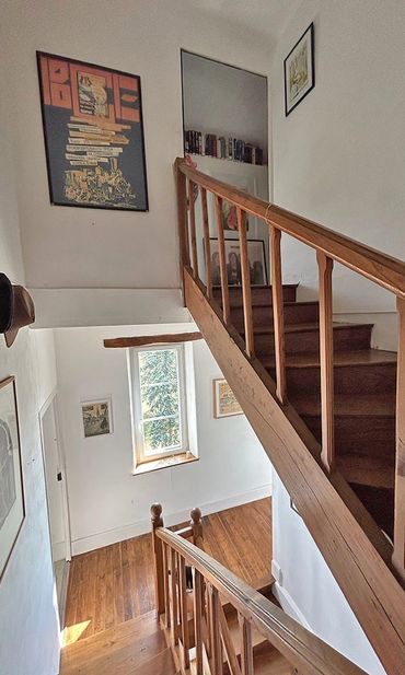 Stairs from the second floor bedrooms to the attic rooms