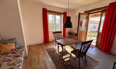The front door leads to an open plan dining room and kitchen