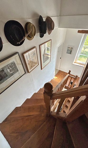 Stairs from the second floor bedrooms to the attic rooms