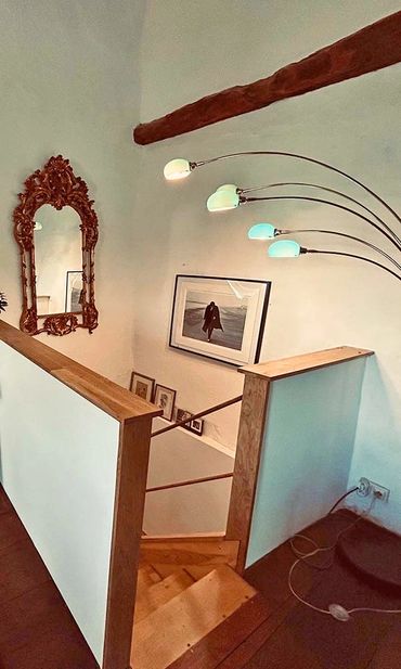 Newly installed oak stairs from the salon to studio below