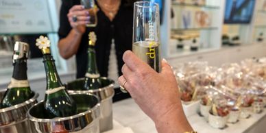 Corporate event with a champagne toast at drybar Eugene