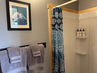Wolf Den Private Bathroom with Shower & Toilet and fresh towels provided.