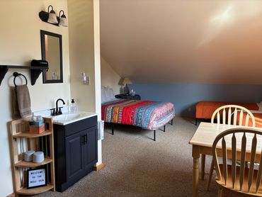 Wolf Den Bathroom Sink, Dining Area and Beds