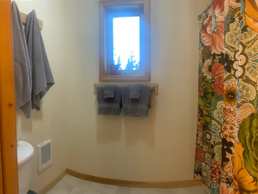 Bathroom with full size tub / shower.