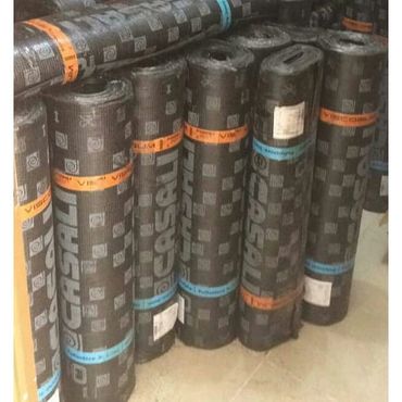 Rolls of waterproofing membrane labeled Casali, stacked upright indoors.
