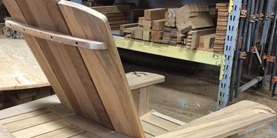 Manufacturing and material selection for a solid teak Sconset Chair Adirondack chair.