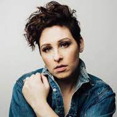 A woman wearing blue shirt and looking front