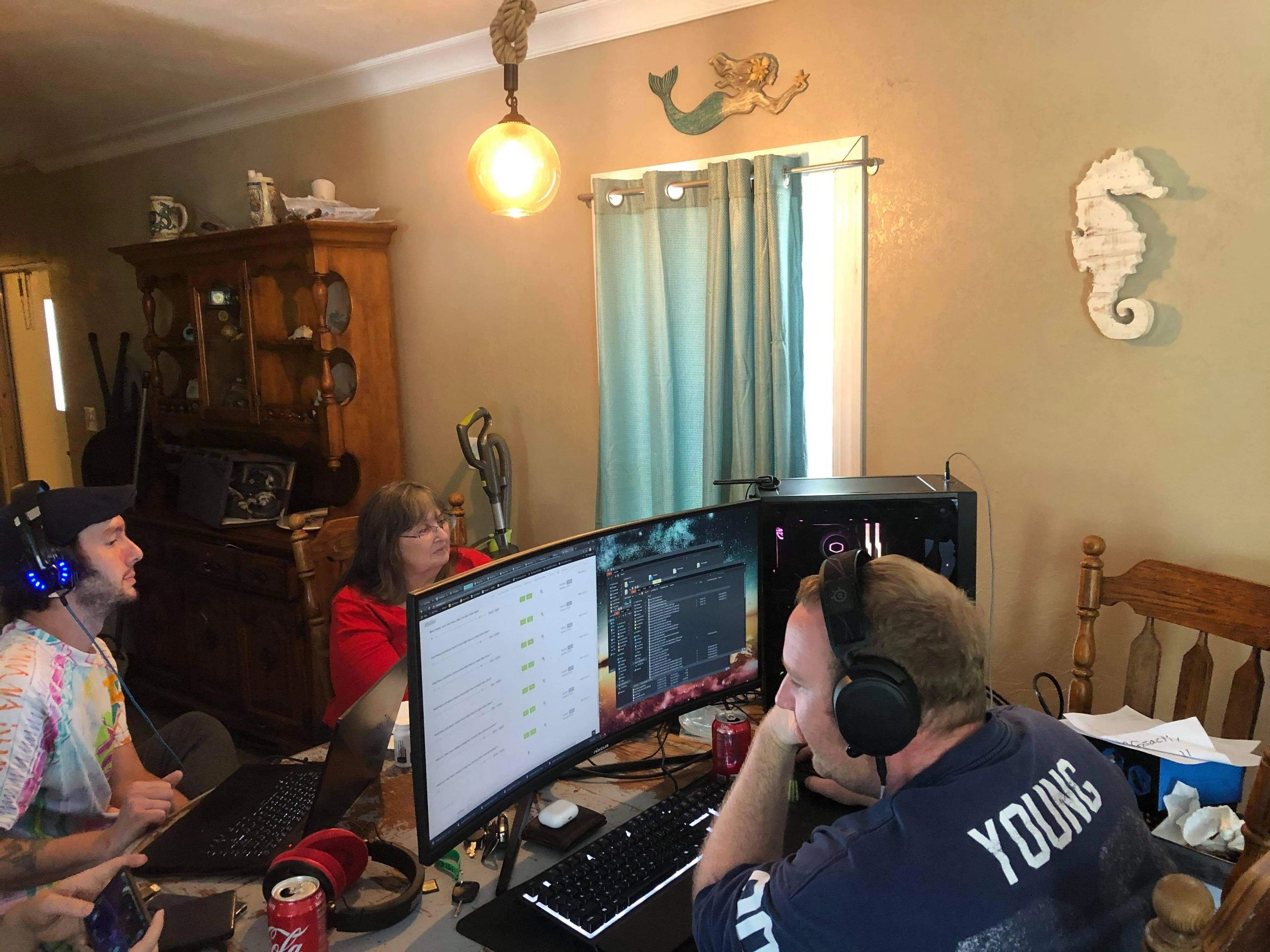 A group of people editing film on computers.