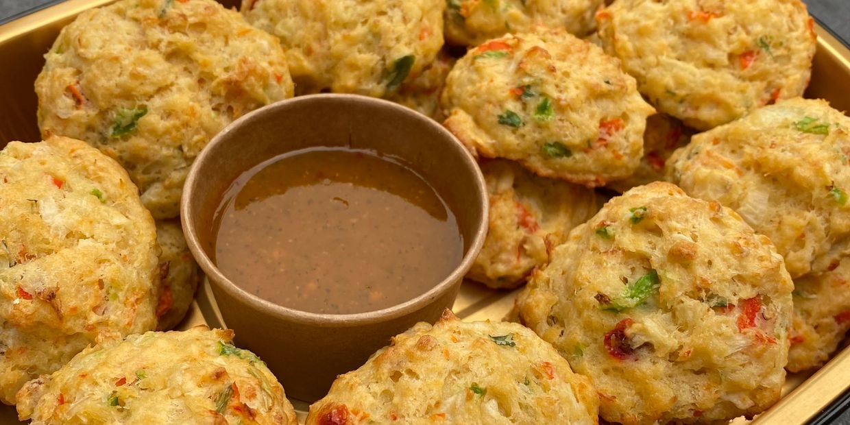 Plate of vegetable fritters with chutney.