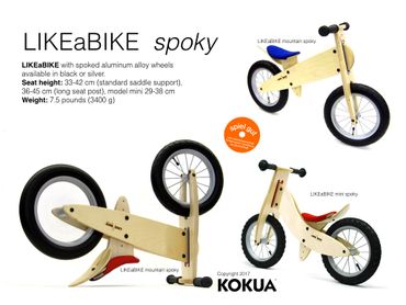 Wooden balance bike with spoked wheels