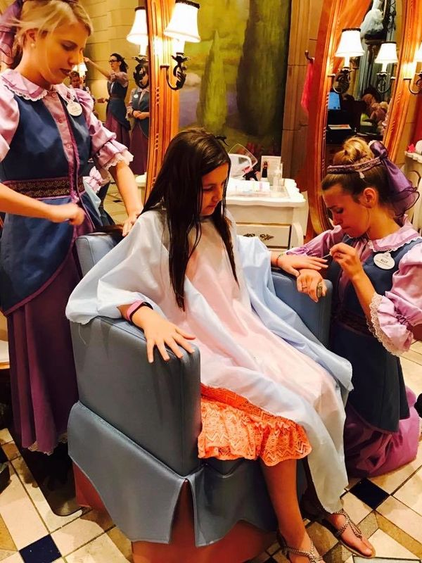 Two Fairy Godmothers pampering Ava at Bibbidi Bobbidi Boutique in Magic Kingdom Cinderella's Castle