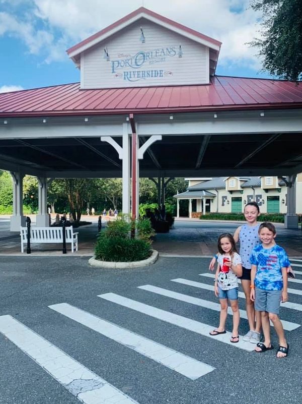 Kids standing outside of Disney's Port Orleans Riverside Resort at Walt Disney World