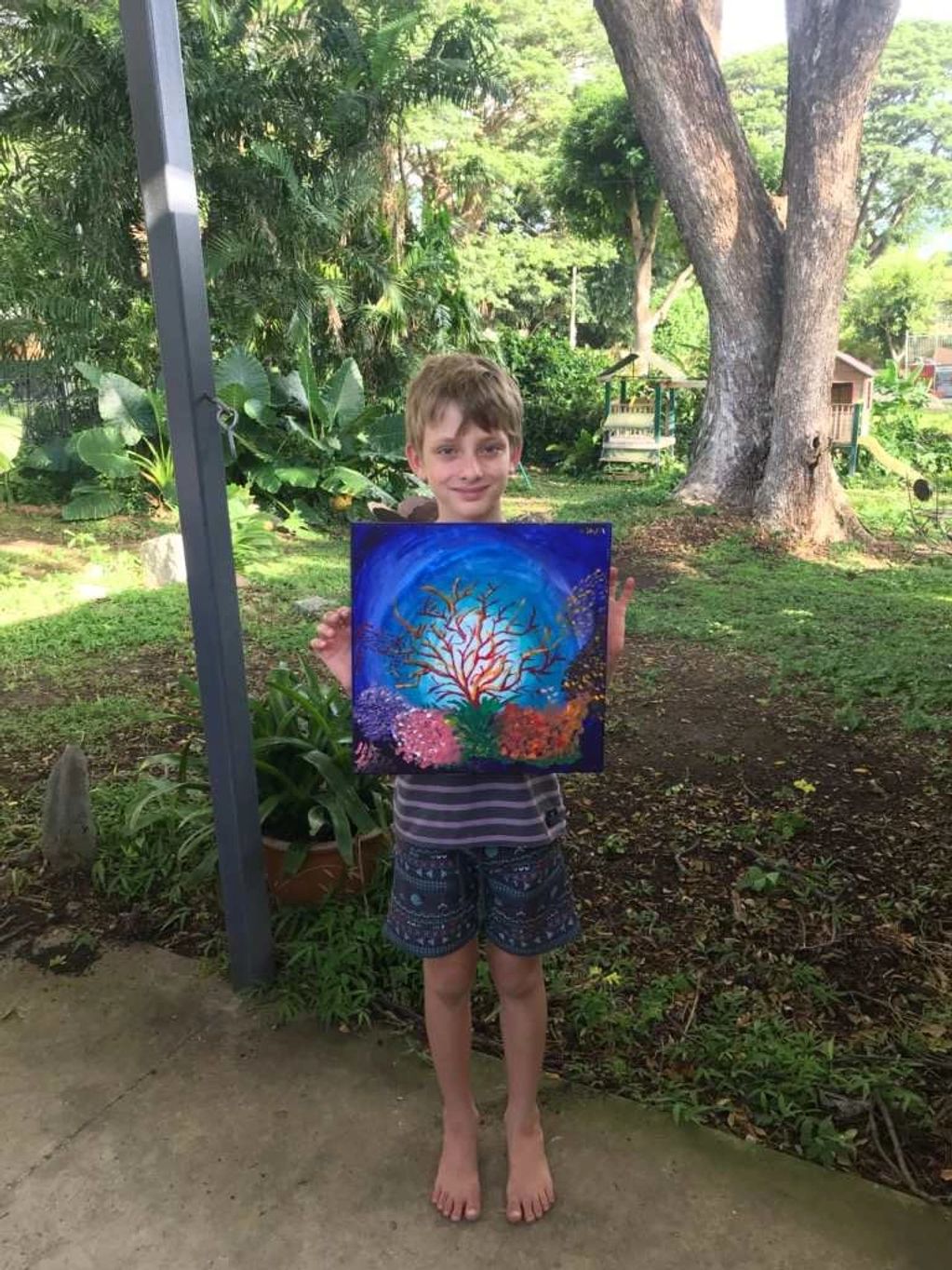 Children with artwork. Paintings created on line. Using art class online. 
Online Art tutorial.