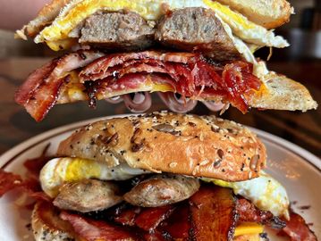 Loaded Breakfast Bagel with bacon, ham, sausage, egg and cheese.